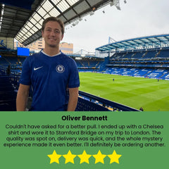 Customer wearing a Chelsea football shirt at Stamford Bridge after receiving an authentic Mystery Jerseys mystery football jersey.